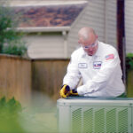 One Hour tech getting ready to perform AC maintenance in Miami, FL